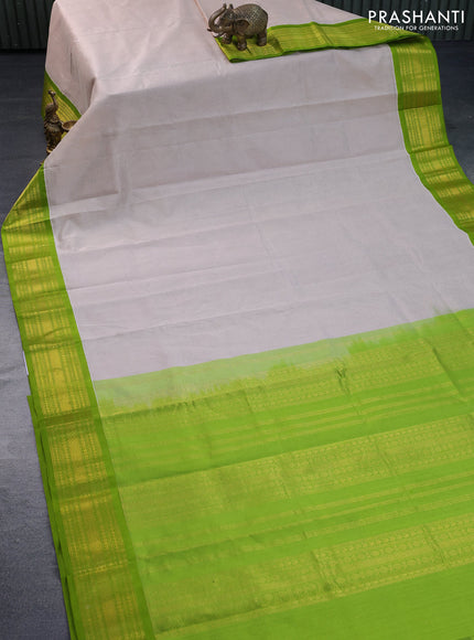 Kuppadam silk cotton saree cream and light green with plain body and zari woven border