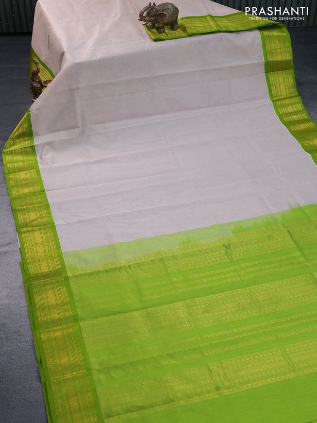 Kuppadam silk cotton saree cream and light green with plain body and zari woven border