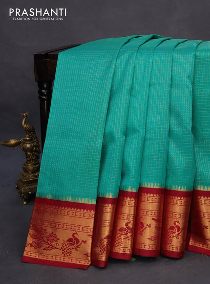 Kuppadam silk cotton saree teal blue and maroon with allover zari checked pattern and peacock design zari woven border