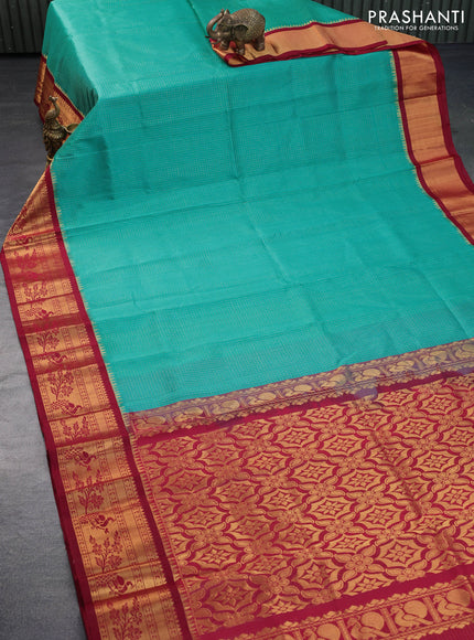 Kuppadam silk cotton saree teal blue and maroon with allover zari checked pattern and peacock design zari woven border