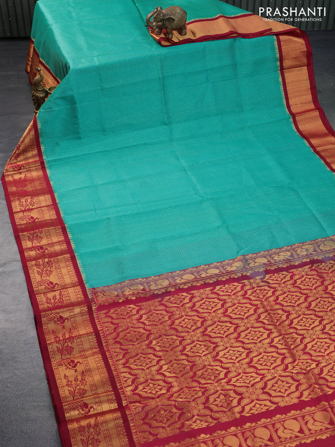 Kuppadam silk cotton saree teal blue and maroon with allover zari checked pattern and peacock design zari woven border