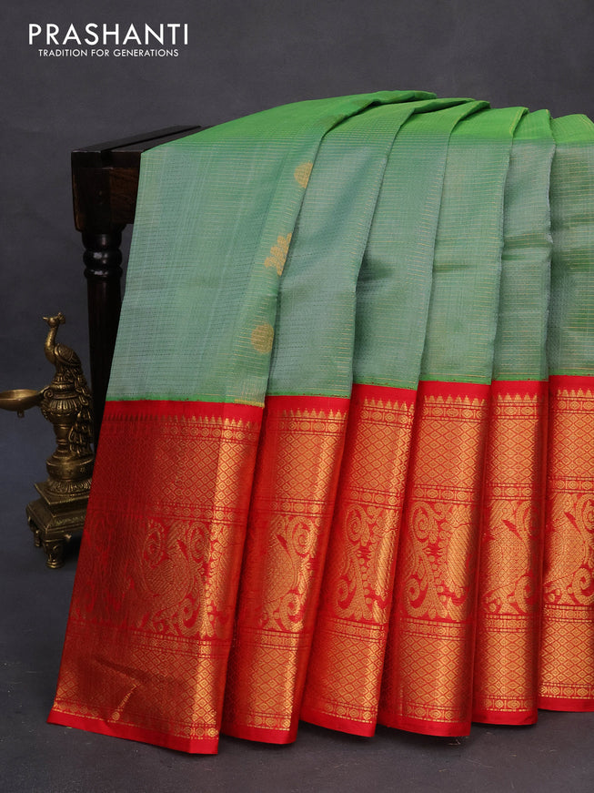 Kuppadam silk cotton saree pastel green and red with allover zari weaves & buttas and long annam zari woven border