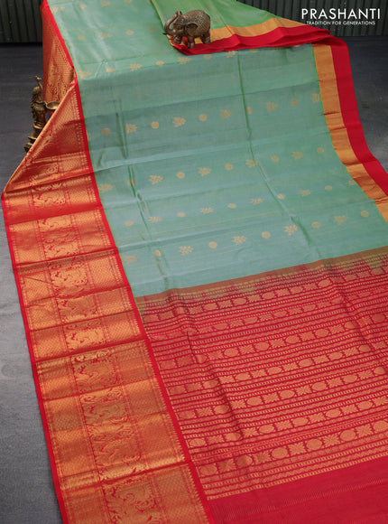 Kuppadam silk cotton saree pastel green and red with allover zari weaves & buttas and long annam zari woven border