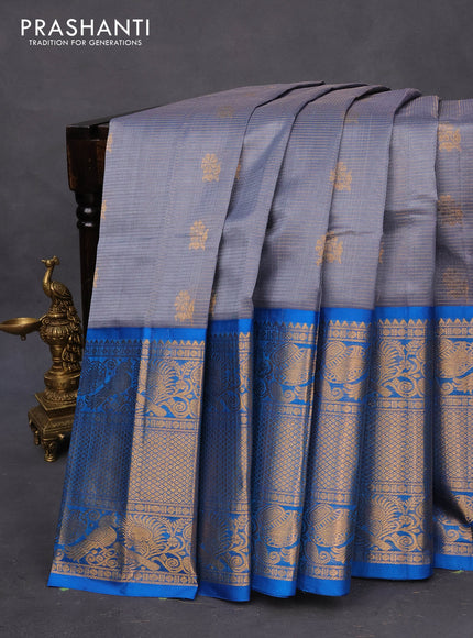 Kuppadam silk cotton saree grey and cs blue with allover zari weaves & buttas and long zari woven border