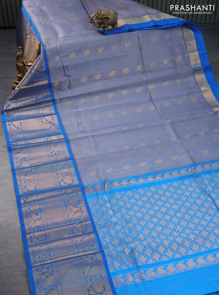 Kuppadam silk cotton saree grey and cs blue with allover zari weaves & buttas and long zari woven border