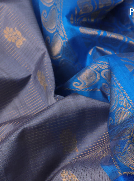 Kuppadam silk cotton saree grey and cs blue with allover zari weaves & buttas and long zari woven border