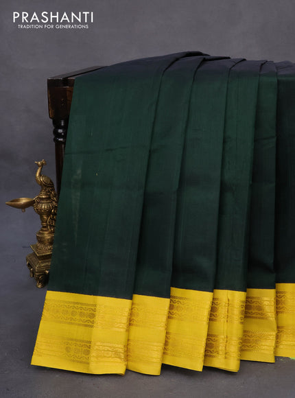 Silk cotton saree bottle green and lime yellow with plain body and zari woven korvai border