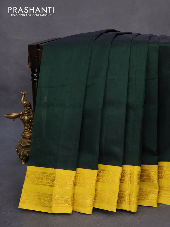 Silk cotton saree bottle green and lime yellow with plain body and zari woven korvai border