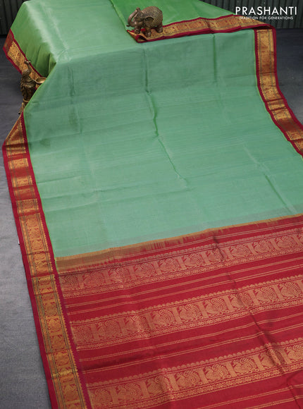 Silk cotton saree green shade and maroon with allover vairaosi pattern and annam zari woven korvai border