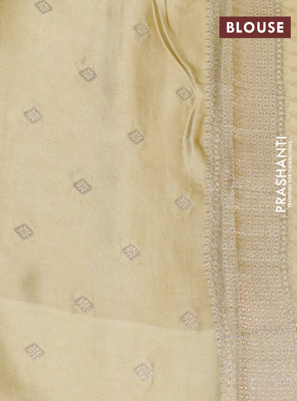 Mushru silk saree pale yellow with allover self emboss and zari woven butta border