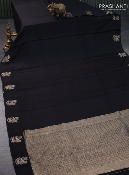 Mushru silk saree black with allover self emboss and zari woven butta border