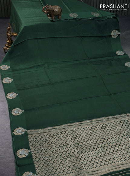 Mushru silk saree green with allover self emboss and zari woven butta border