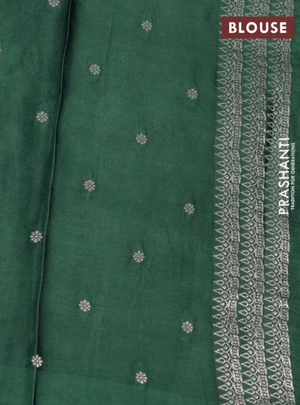 Mushru silk saree green with allover self emboss and zari woven butta border