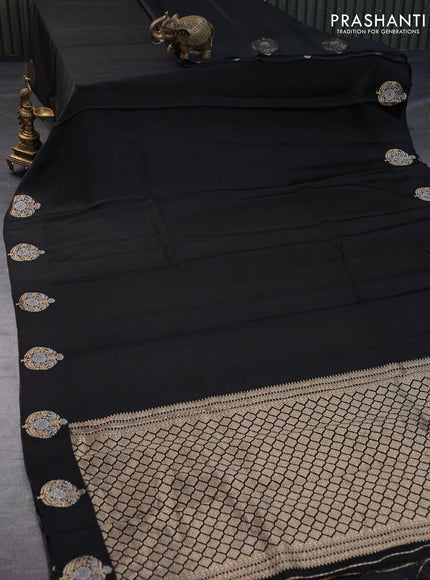 Mushru silk saree black with allover self emboss and zari woven butta border