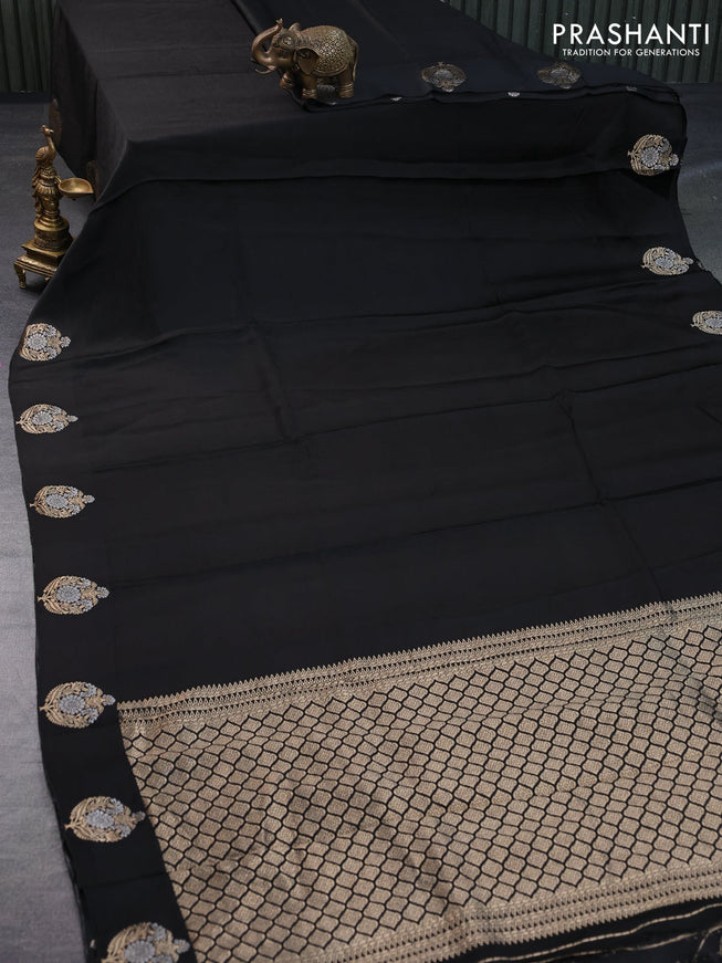 Mushru silk saree black with allover self emboss and zari woven butta border