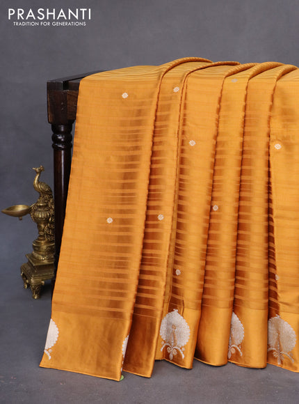 Mushru silk saree dark mustard with allover stripe pattern & zari buttas and zari woven butta border