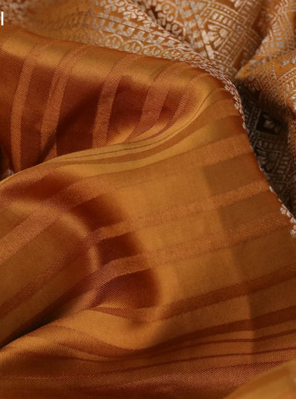 Mushru silk saree dark mustard with allover stripe pattern & zari buttas and zari woven butta border