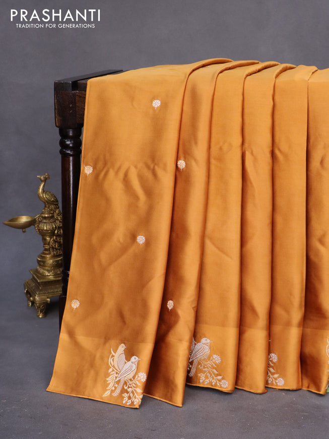 Mushru silk saree dark mustard with silver & gold zari woven buttas and zari woven butta border