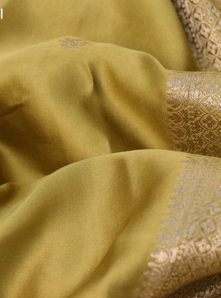 Mushru silk saree mustard green with zari woven buttas and zari woven butta border