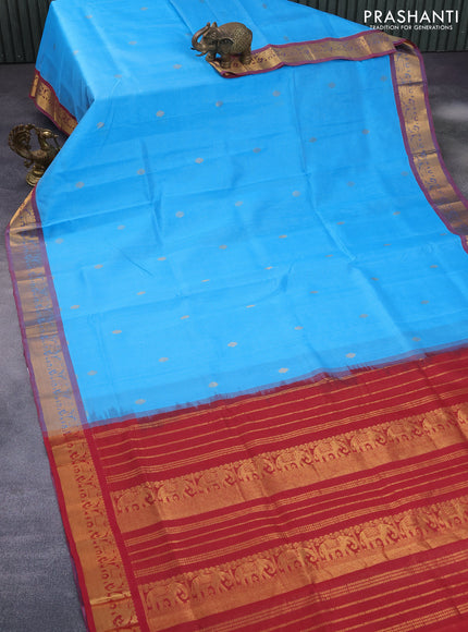 Silk cotton saree light blue and maroon with allover vairaosi pattern & buttas and elephant zari woven border