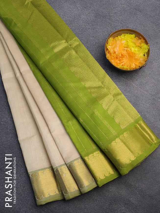 Silk cotton saree cream and light green with allover vairaosi pattern and zari woven border