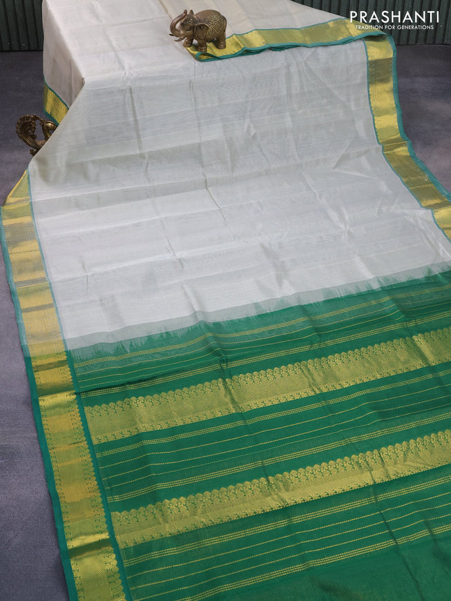 Silk cotton saree pastel grey and green with allover vairaosi pattern and zari woven border