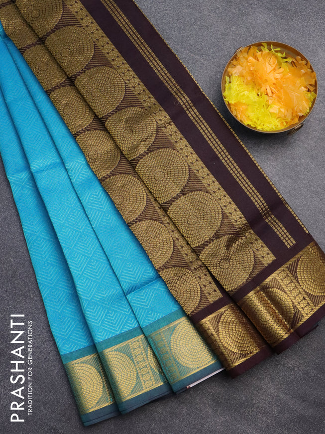 Silk cotton saree light blue and deep jamun shade with allover self emboss jacquard and zari woven border