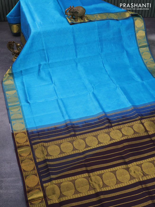 Silk cotton saree light blue and deep jamun shade with allover self emboss jacquard and zari woven border