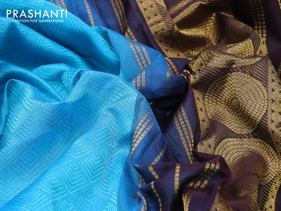 Silk cotton saree light blue and deep jamun shade with allover self emboss jacquard and zari woven border