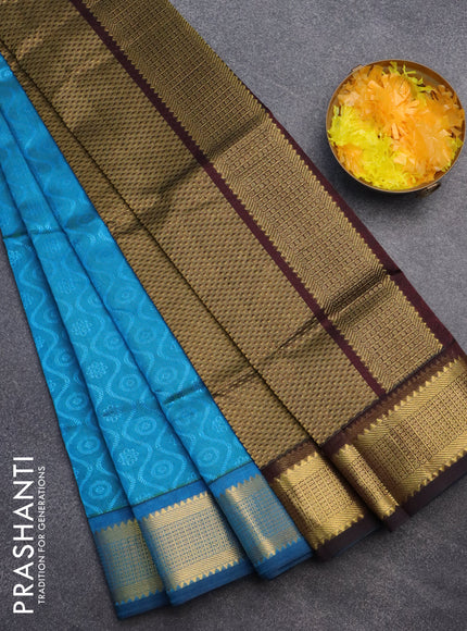 Silk cotton saree light blue and deep coffee brown with allover self emboss jacquard and zari woven border