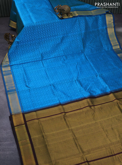 Silk cotton saree light blue and deep coffee brown with allover self emboss jacquard and zari woven border