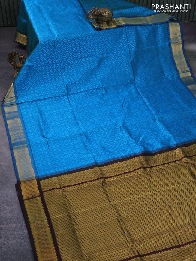 Silk cotton saree light blue and deep coffee brown with allover self emboss jacquard and zari woven border