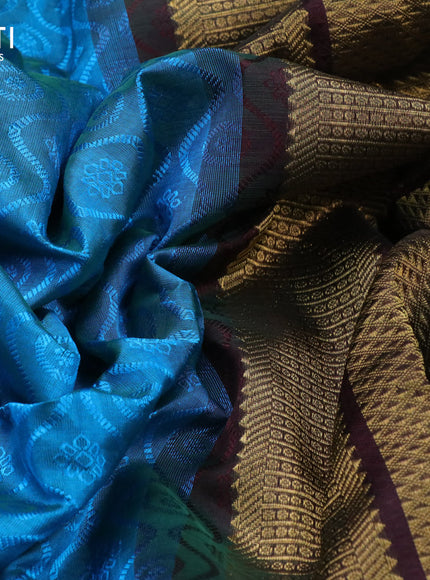 Silk cotton saree light blue and deep coffee brown with allover self emboss jacquard and zari woven border