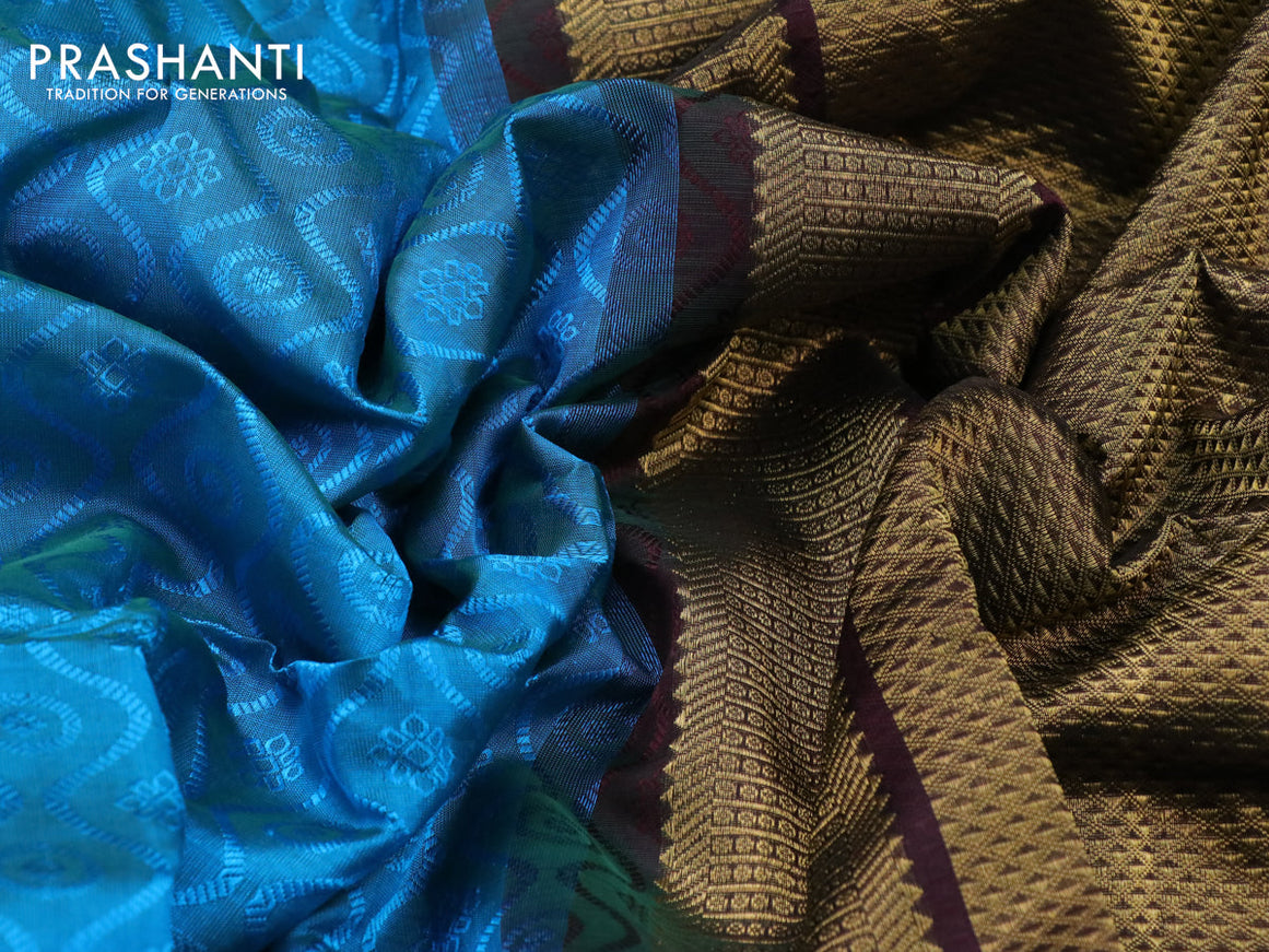 Silk cotton saree light blue and deep coffee brown with allover self emboss jacquard and zari woven border