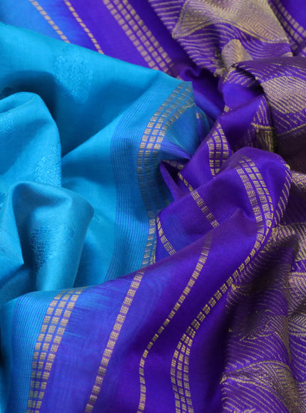 Silk cotton saree teal blue and blue with allover self emboss jacquard and zari woven border