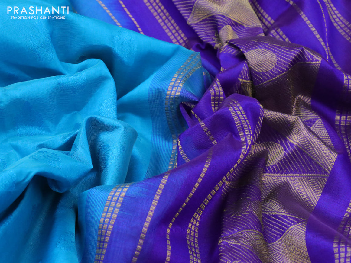 Silk cotton saree teal blue and blue with allover self emboss jacquard and zari woven border