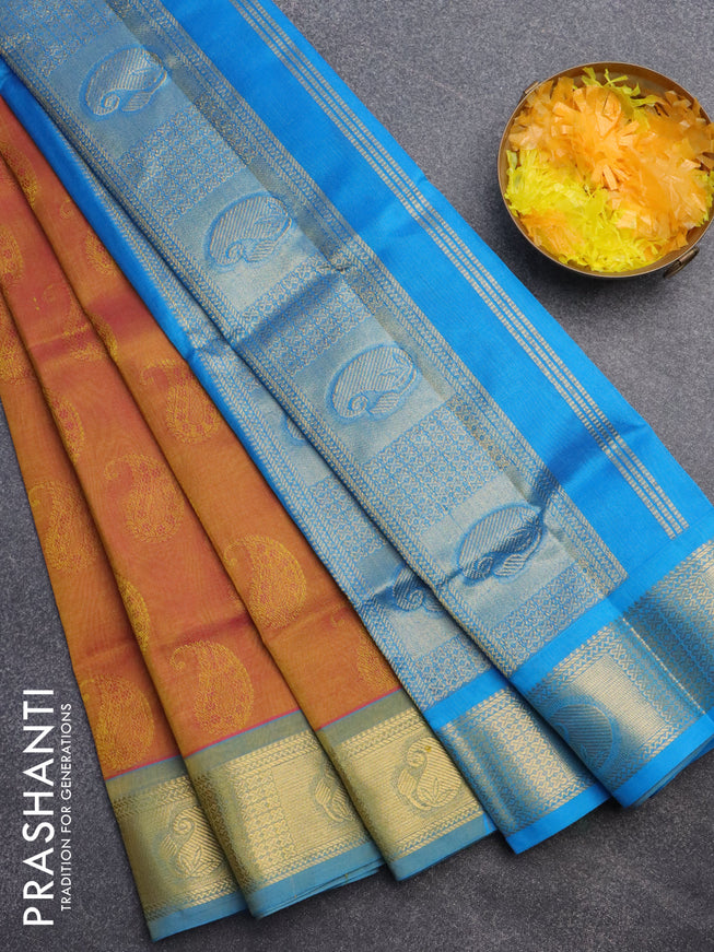 Silk cotton saree dual shade of mustard yellowish pink and cs blue with allover self emboss jacquard and zari woven border