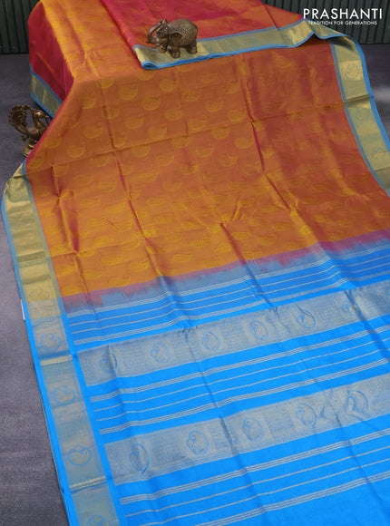 Silk cotton saree dual shade of mustard yellowish pink and cs blue with allover self emboss jacquard and zari woven border