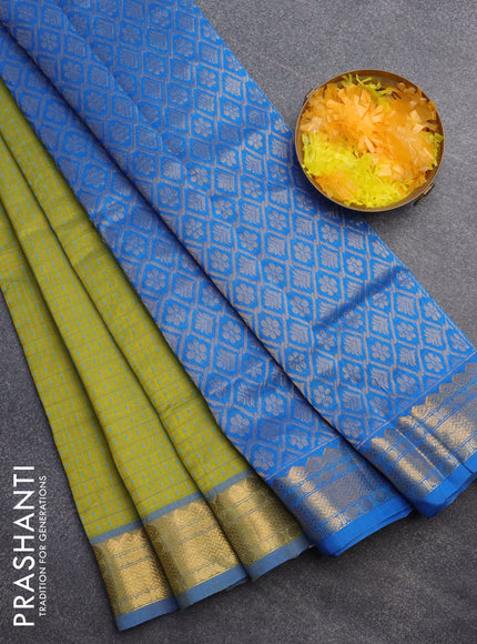 Silk cotton saree lime green and cs blue with allover small thread checks & buttas and zari woven border