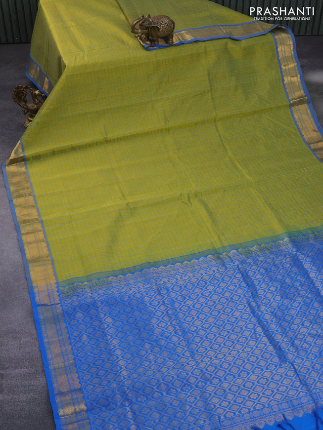 Silk cotton saree lime green and cs blue with allover small thread checks & buttas and zari woven border