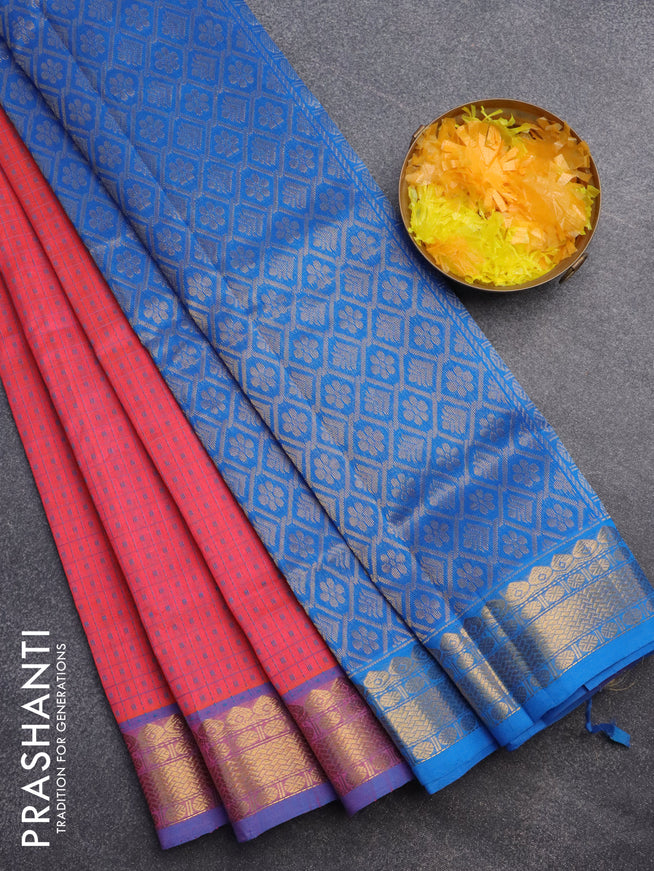 Silk cotton saree dual shade of pinkish orange and cs blue with allover small thread checks & buttas and zari woven border