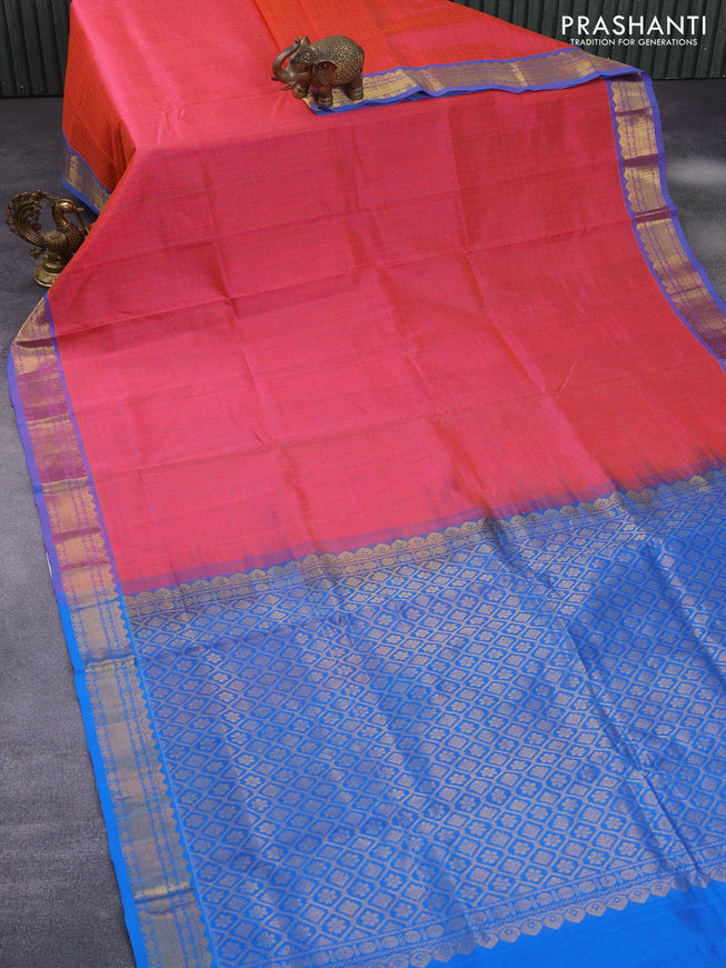 Silk cotton saree dual shade of pinkish orange and cs blue with allover small thread checks & buttas and zari woven border