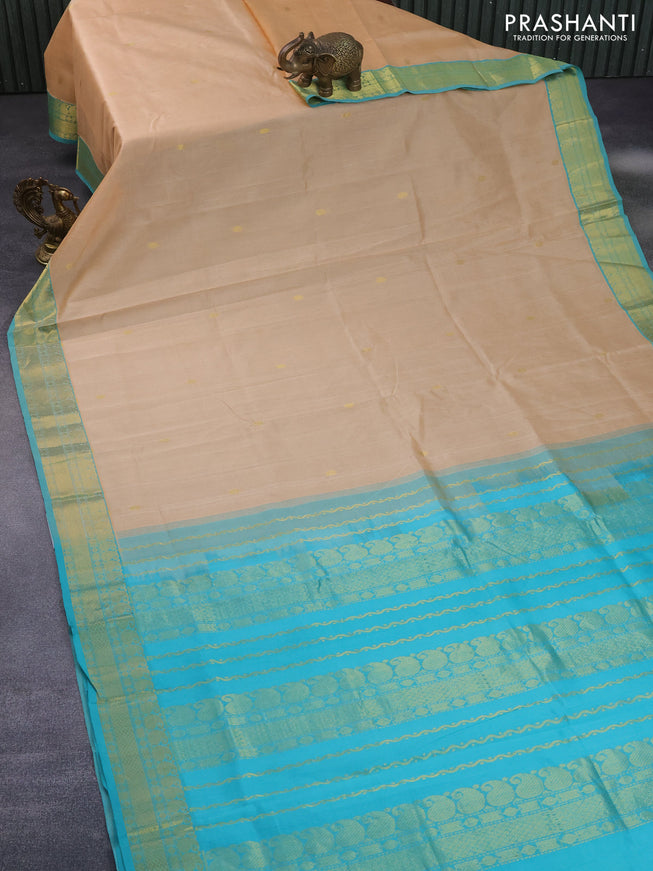 Silk cotton saree sandal and teal blue with rudhraksha zari woven buttas and paisley zari woven border