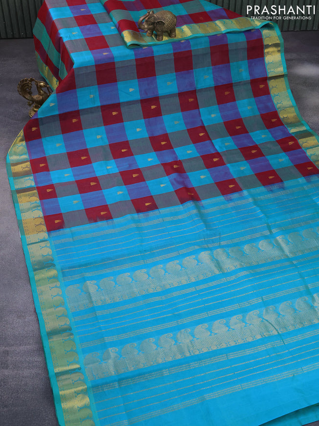 Silk cotton saree maroon and cs blue with allover paalum pazhamum checks & buttas and paisley zari woven border