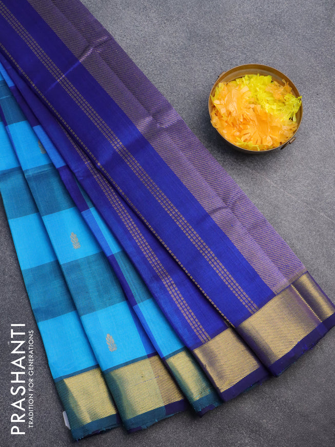 Silk cotton saree light blue and blue with allover paalum pazhamum checks & buttas and zari woven border