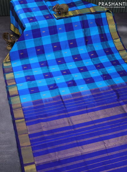 Silk cotton saree light blue and blue with allover paalum pazhamum checks & buttas and zari woven border