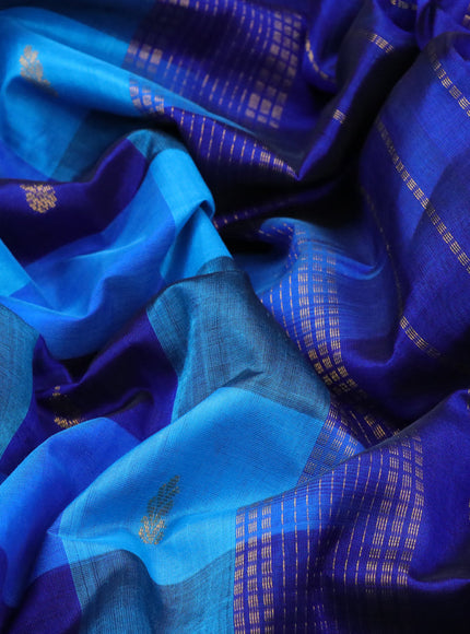 Silk cotton saree light blue and blue with allover paalum pazhamum checks & buttas and zari woven border