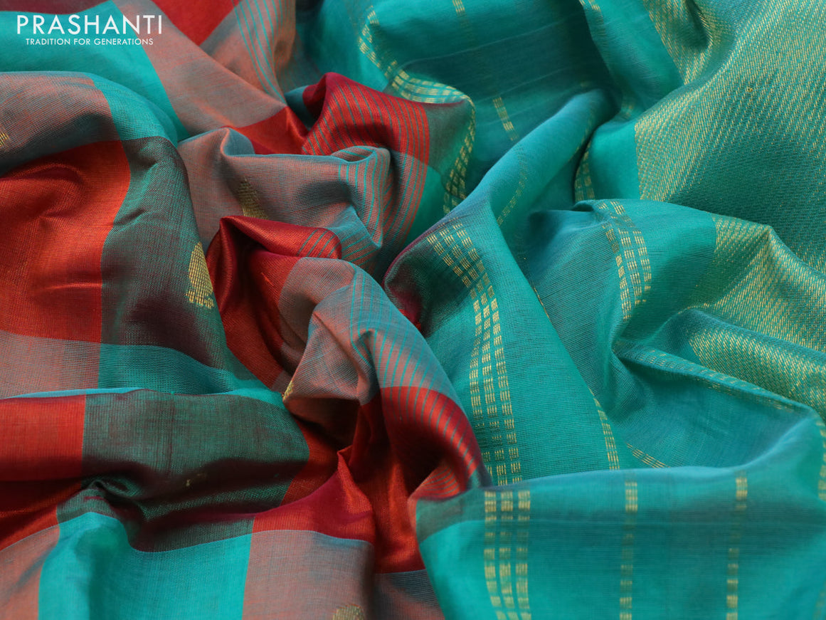 Silk cotton saree rustic orange and teal green with allover paalum pazhamum checks & buttas and zari woven border