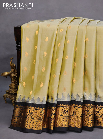 Pure gadwal silk saree elaichi green and black with zari woven buttas and temple design zari woven border