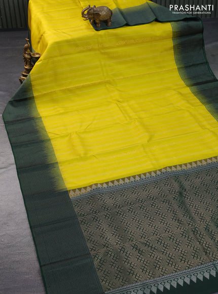 Pure soft silk saree yellow and green with allover zari weaves and silver zari woven border